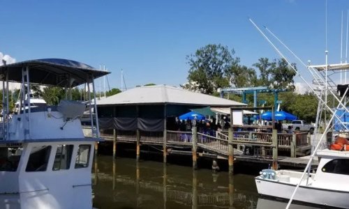 a boat is docked next to a body of water