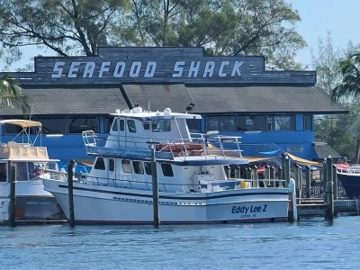 a boat is docked in front of a building